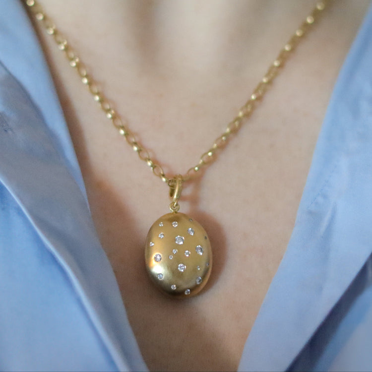 goldfinch jewellery 18ct yellow gold diamond set brushed gold egg shaped oval domed pendant on belcher chain on model