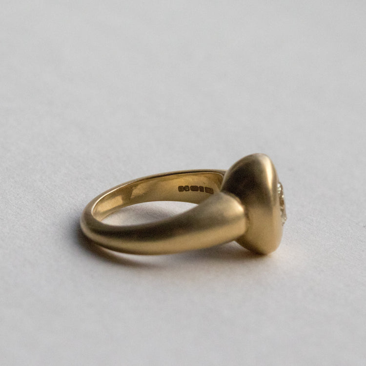 solid heavy 18ct yellow gold curved oval signet ring with oval natural yellow diamond with brushed gold. side view inside hallmark visible
