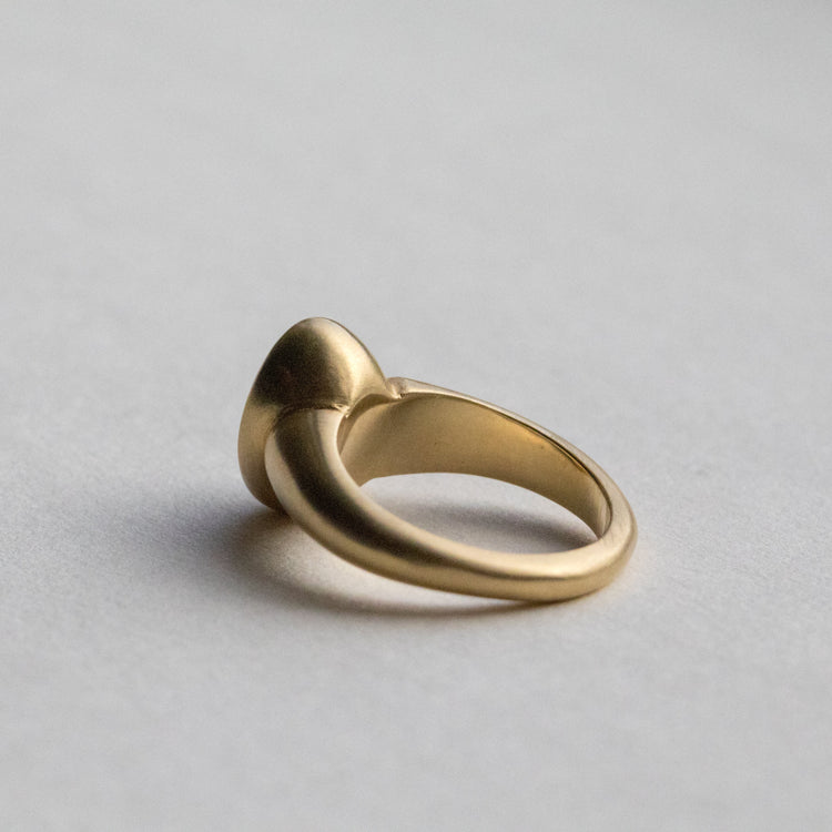 solid heavy 18ct yellow gold curved oval signet ring with oval natural yellow diamond with brushed gold. photographed inside