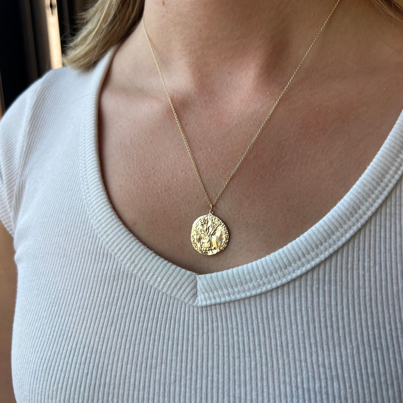 molten gold coin design necklace worn