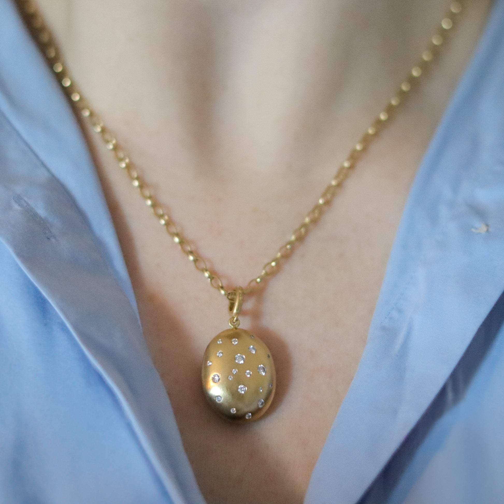 goldfinch jewellery 18ct yellow gold diamond set brushed gold egg shaped oval domed pendant on belcher chain on model 