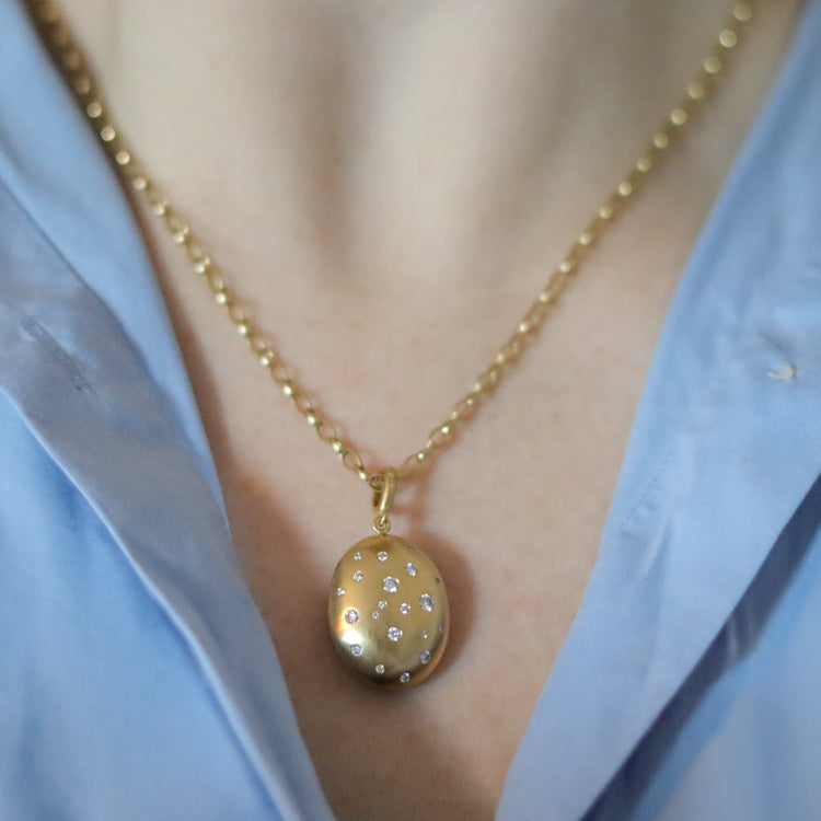 goldfinch jewellery 18ct yellow gold diamond set brushed gold egg shaped oval domed pendant on belcher chain on model 