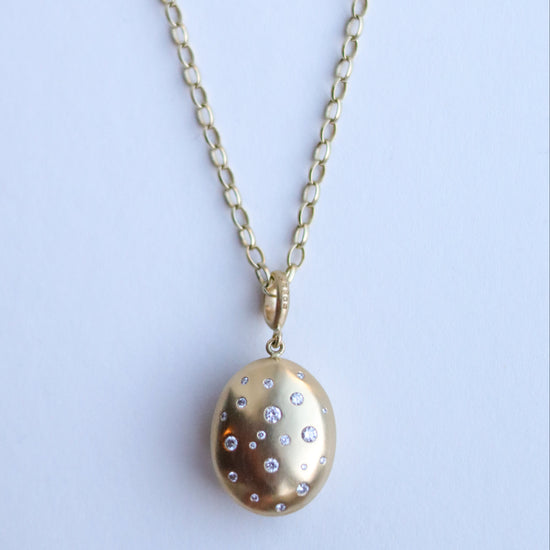 18ct yellow gold speckled diamond set brushed gold egg shaped oval domed pendant on belcher chain paper shot