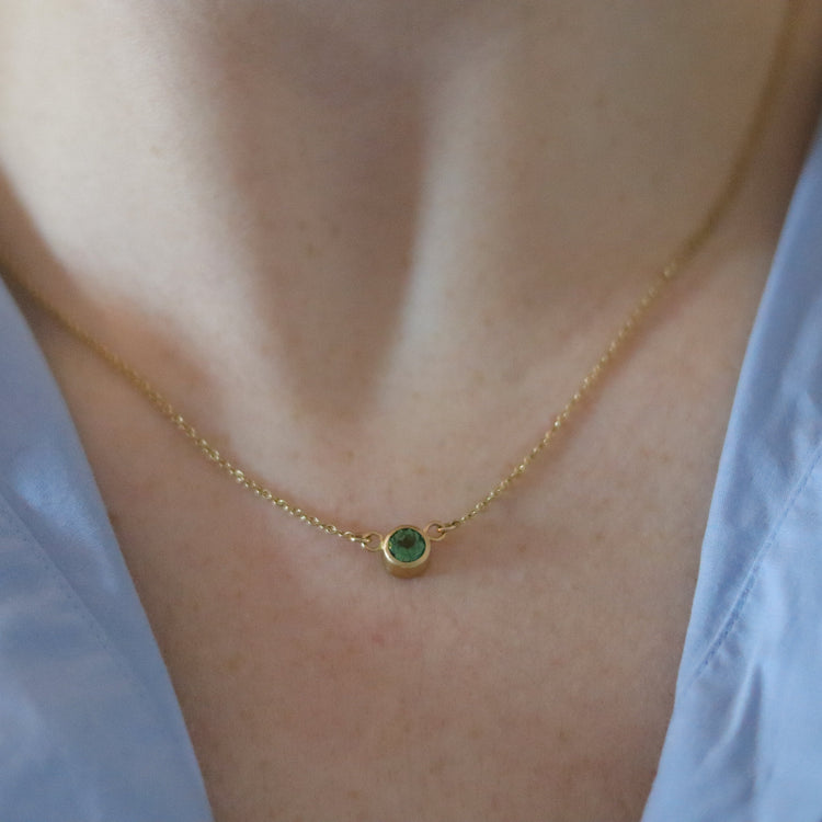 goldfinch jewellery Minimalist brushed 18ct yellow gold necklace featuring a mint green tourmaline on a fine gold chain on model zoom 