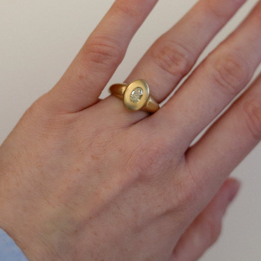goldfinch jewellery solid heavy 18ct yellow gold curved oval signet ring with oval natural yellow diamond with brushed gold. photographed on hand