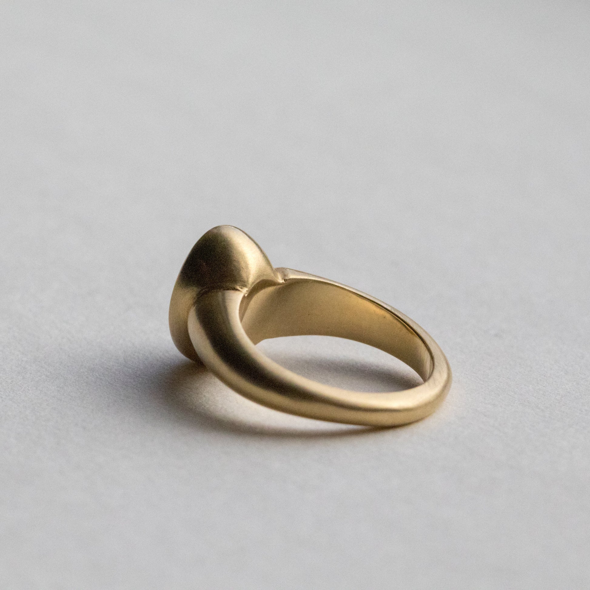 solid heavy 18ct yellow gold curved oval signet ring with oval natural yellow diamond with brushed gold. photographed inside
